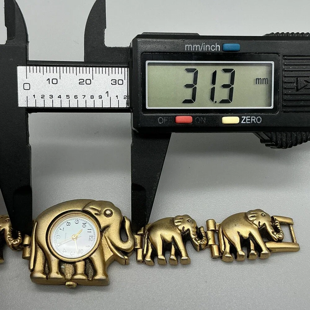 Womens Watch 31mm White Dial Gold Tone Elephant Bracelet New Battery 6.5